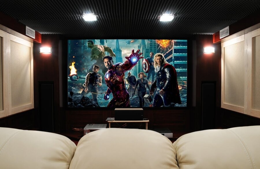 A professional home theater setup with Avengers (2012) on the screen.