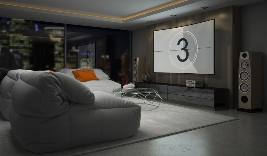home theater space featuring floorstanding speakers as part of a surround sound system.