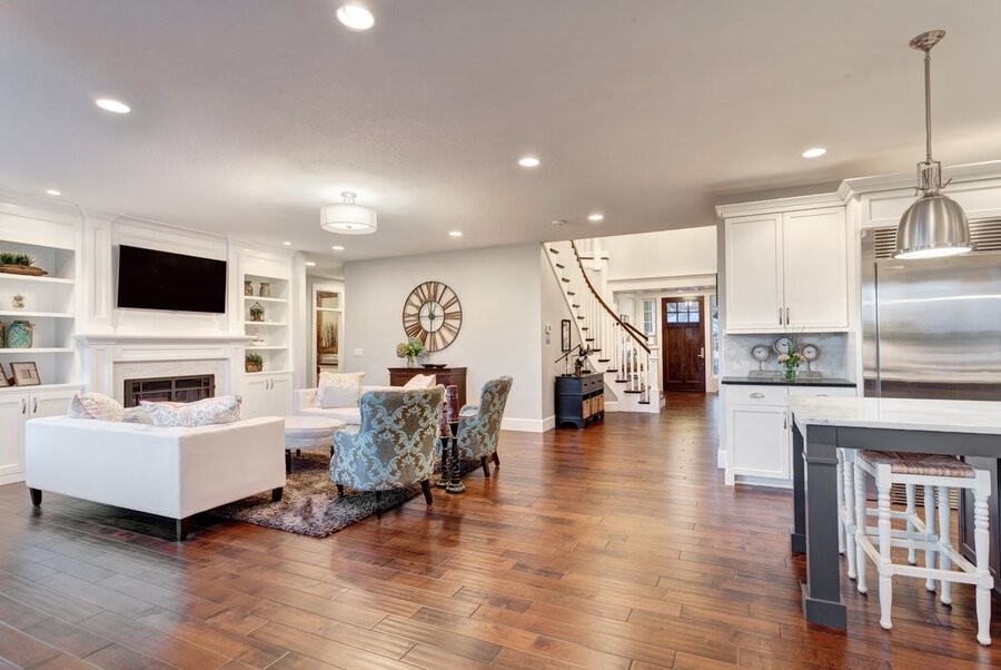 An open living space featuring a professional lighting design with several lighting fixtures.